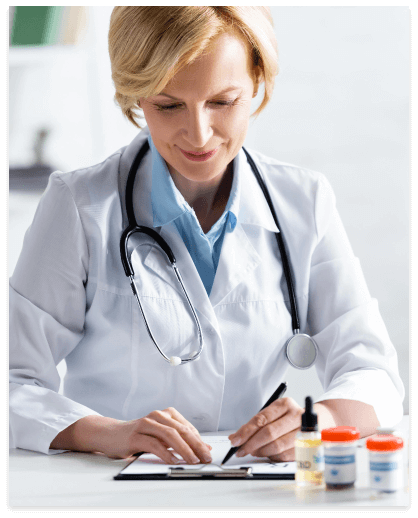 selective-focus-of-cheerful-and-mature-doctor-writ-2023-11-27-05-08-49-utc